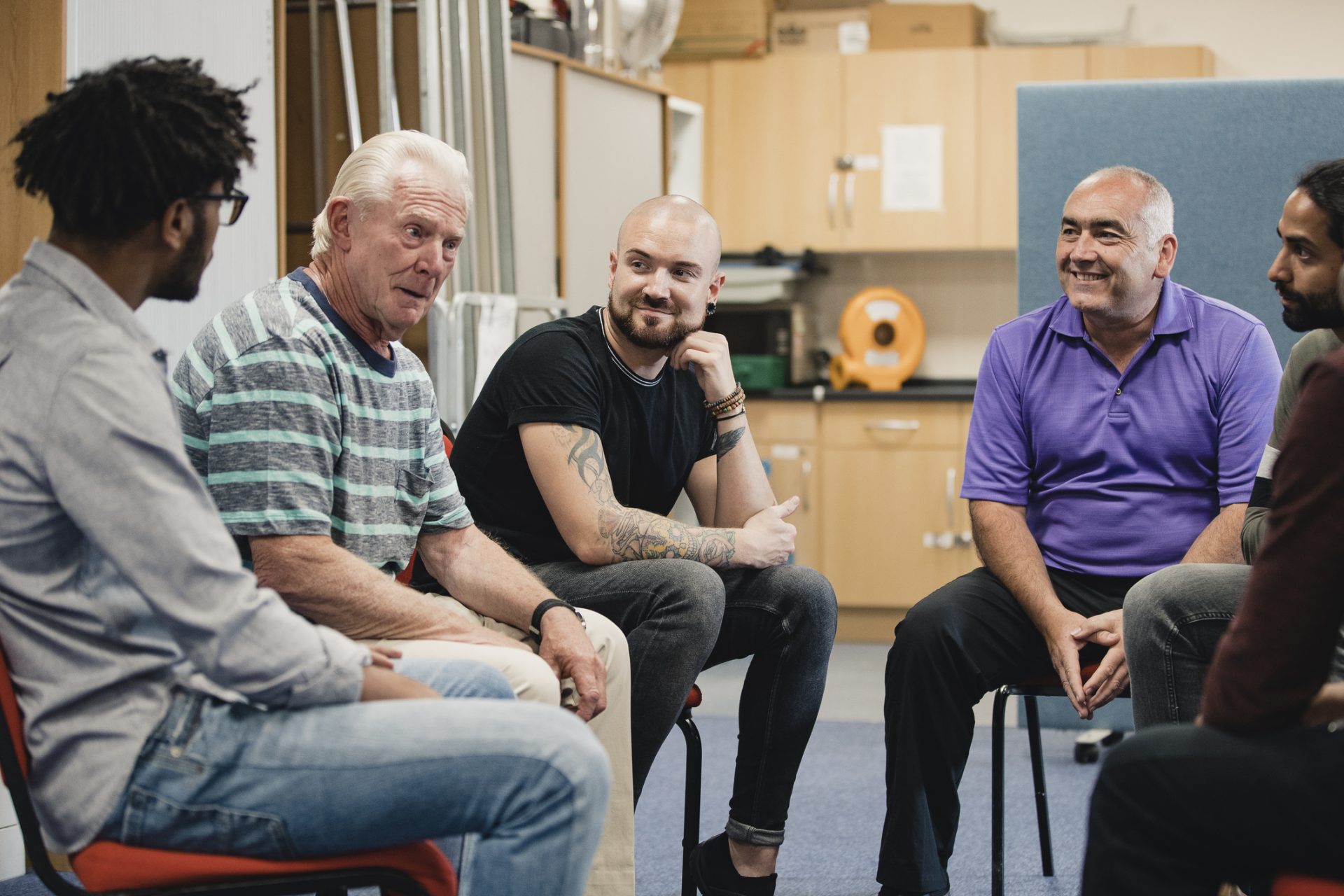 A group of men sat down talking.