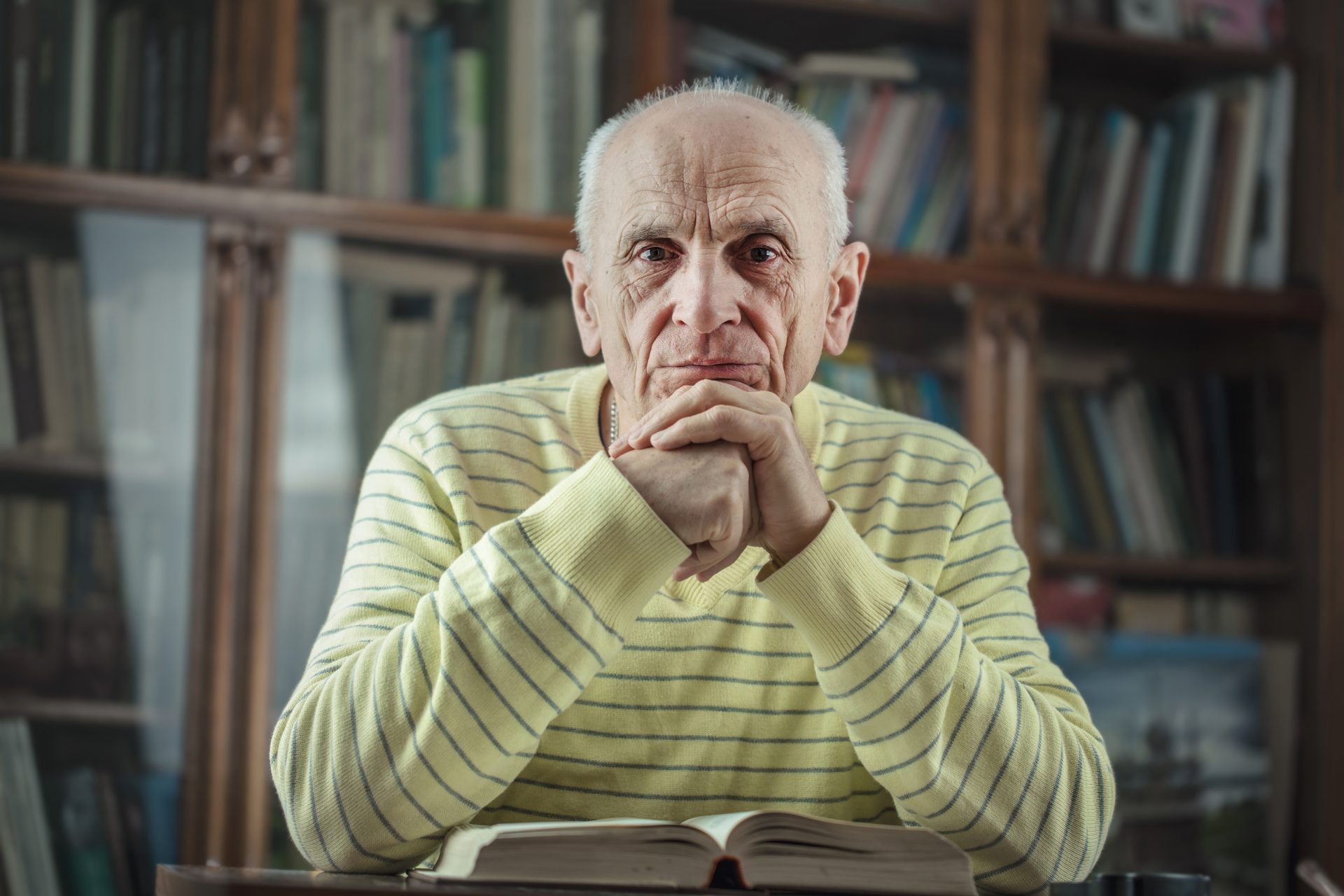 An older man reading a book