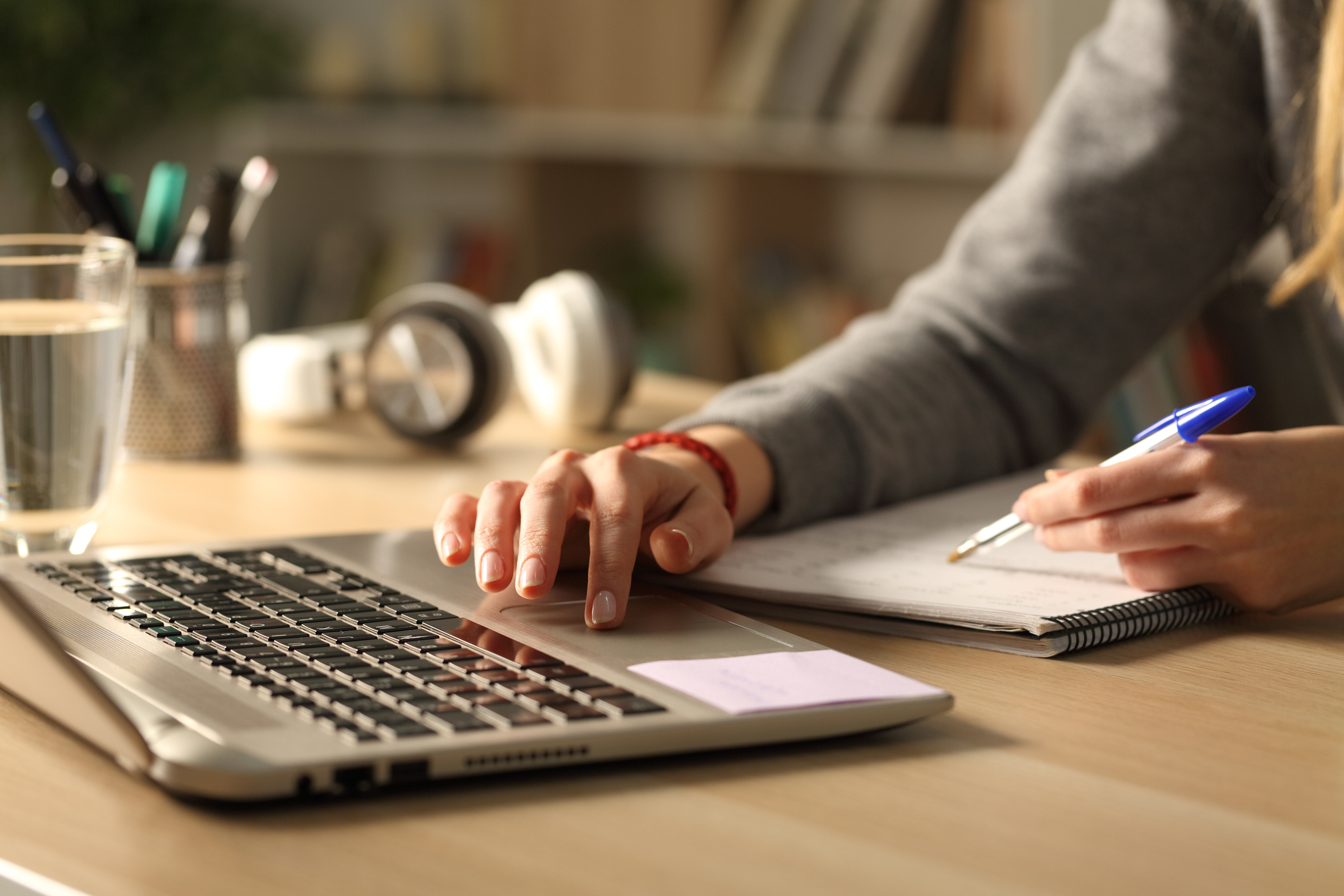 the photo shows a desk inside containing a laptop computer