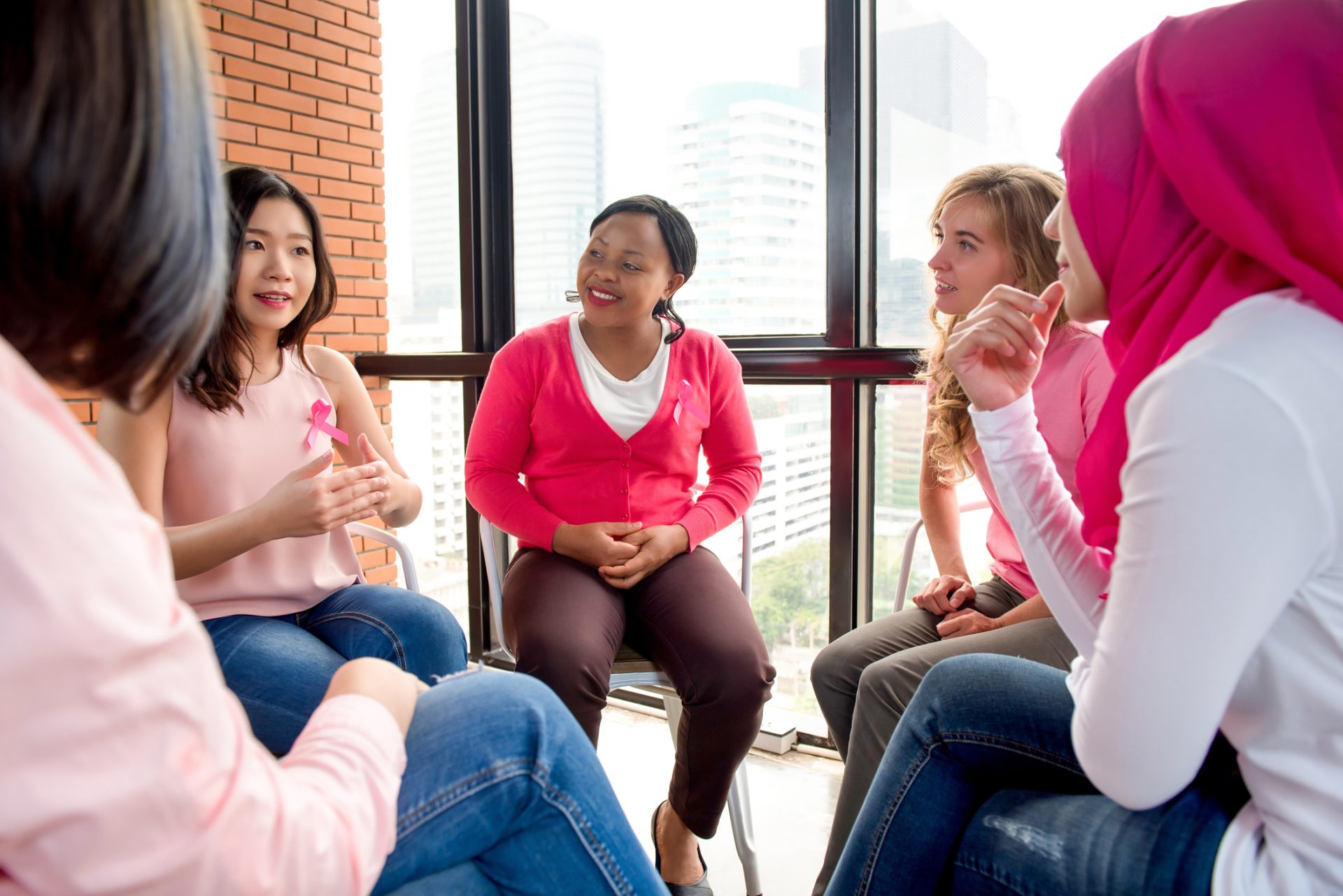 A group of people talking with each other