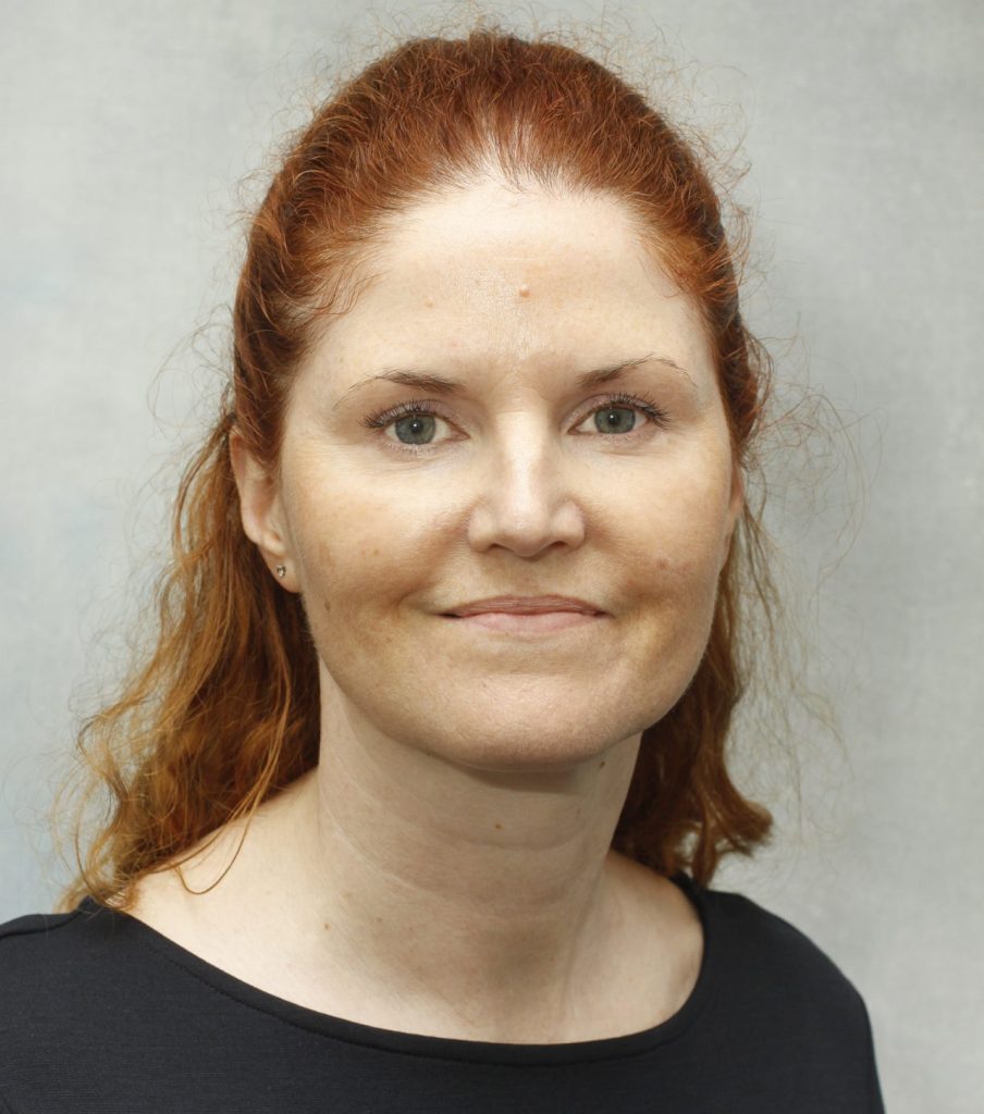 the photo shows our trustee Tracey smiling at the camera